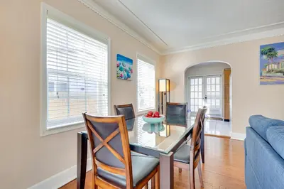 a dining room with a table and chairs and a couch at House with Shared Pool Access 4 Mi to Beaches! in Fort Lauderdale