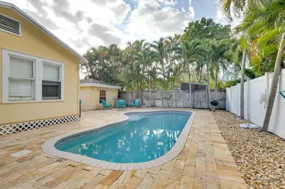a swimming pool in the backyard of a house at Detached Backyard Studio in Fort Lauderdale! in Fort Lauderdale