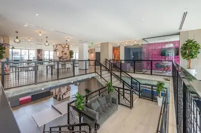 a view of a lobby with stairs and plants at Great 3 beds 3 baths Appartment Downtown Miami in Miami