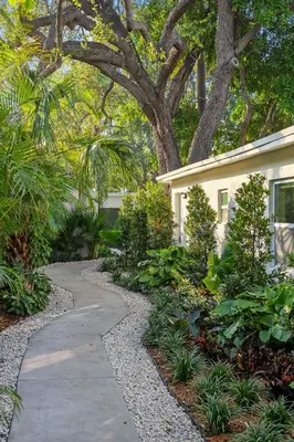 a garden with a walkway next to a house at 921 Apartment 1 in Fort Lauderdale