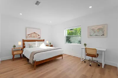 a bedroom with a bed and a desk and a window at 921 Apartment 2 in Fort Lauderdale
