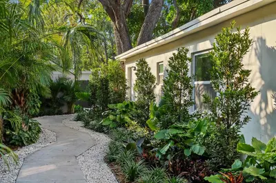 a garden path next to a house with plants at 921 Apartment 2 in Fort Lauderdale