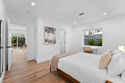 a white bedroom with a bed and a window at 921 Apartment 2 in Fort Lauderdale