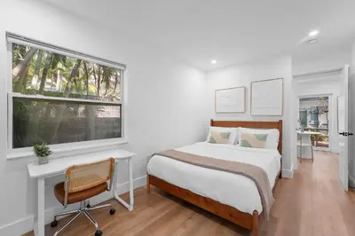 a bedroom with a bed and a desk and a window at 921 Apartment 3 in Fort Lauderdale