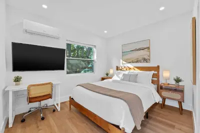 a bedroom with a bed and a desk and a tv at 921 Apartment 4 in Fort Lauderdale
