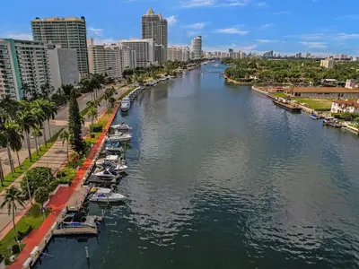a river in a city with boats in the water at Chic 2-Bedroom Condo with Beach Service & Gym / 1210 in Miami Beach