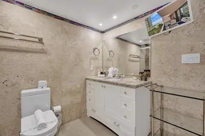 a bathroom with a toilet and a sink at Stunning 2-Bedroom Condo with Beach Service 614 in Miami Beach