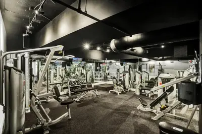 a gym with several treadmills and machines at Stunning 2-Bedroom Condo with Beach Service 614 in Miami Beach