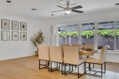 a dining room with a table and chairs at POOL & BBQ with the family in Biscayne Park