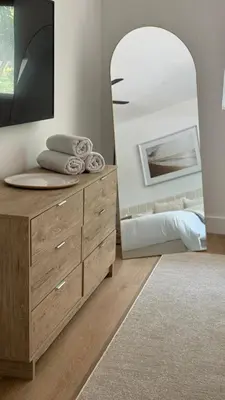 a bedroom with a dresser and a mirror at POOL & BBQ with the family in Biscayne Park