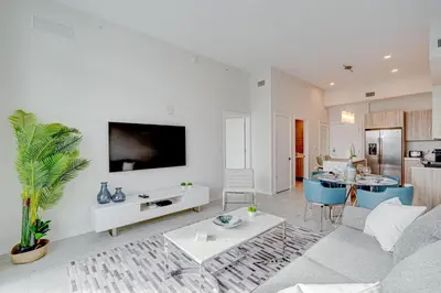 a living room with a couch and a table at 3900-604LG DESIGN DISTRICT, CONDO 1 BEDROOM & 1 BATHROOM in Miami