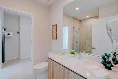 a white bathroom with a sink and a toilet at 3900-604LG DESIGN DISTRICT, CONDO 1 BEDROOM & 1 BATHROOM in Miami