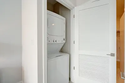 a laundry room with a washer and dryer at 3900-604LG DESIGN DISTRICT, CONDO 1 BEDROOM & 1 BATHROOM in Miami