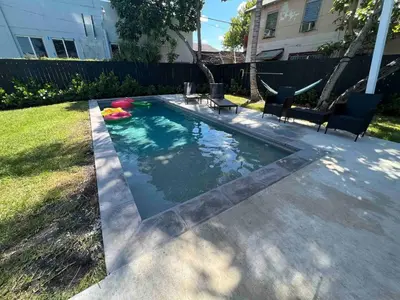 a swimming pool in the backyard of a house at Wynwood House With Pool, Hotub and Parking in Miami