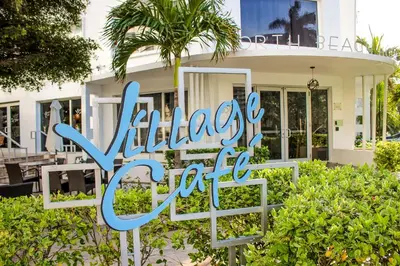 a sign for a wellness center in front of a building at North Beach Hotel in Fort Lauderdale