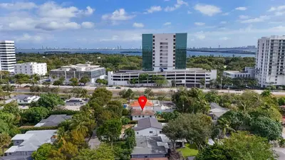 an aerial view of a city with a red marker at Retro Rewind - Location parking and all the vibes in Miami