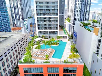an aerial view of a resort with a swimming pool at Stylish One Bedroom in the heart of vibrant Downtown- Daily resort fee and parking not included in Miami