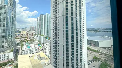 an aerial view of a tall building in a city at Stylish One Bedroom in the heart of vibrant Downtown- Daily resort fee and parking not included in Miami