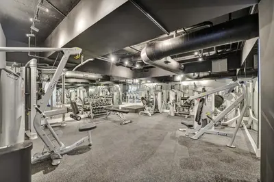 a gym with several treadmills and machines at Beautiful Oceanview Condo with Beach Service 504 in Miami Beach