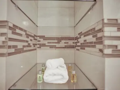 a towel sitting on a glass table in a room at 2 Bedroom Condo with Resort Amenities, Pool and Gym 618 in Miami Beach