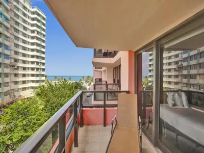 a balcony with a view of the ocean at 2 Bedroom Condo with Resort Amenities, Pool and Gym 618 in Miami Beach