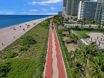 a view of the beach in front of a resort at Comfortable 2-Bedroom Condo Retreat with Resort Facilities 1108 in Miami Beach