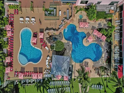 an aerial view of a resort with two swimming pools at Comfortable 2-Bedroom Condo Retreat with Resort Facilities 1108 in Miami Beach