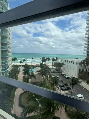a view of the beach from the balcony of a building at 1 bedroom with amazing ocean view in Hollywood