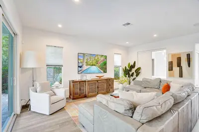 a living room with a large couch and two chairs at The Secret Garden - Stunning Luxurious Villa in Fort Lauderdale in Fort Lauderdale