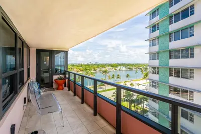 an apartment balcony with a view of the water at Huge Beachfront 2400sqft 5 Bedroom 5 Bathroom with Ocean View in Miami Beach