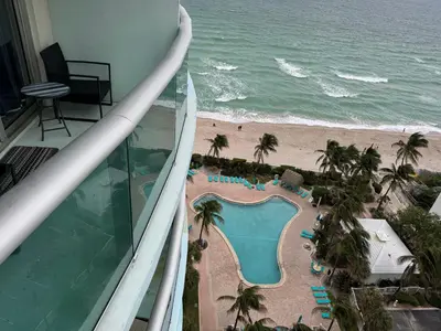 a view of the beach from the balcony of a resort at Spectacular ocean view 1 bedroom in Hollywood in Hollywood