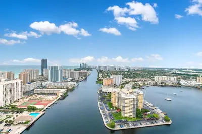 an aerial view of a city with a river at 1 Bdm & Kitchen at Beachwalk Pool Gym Beach in Hallandale Beach