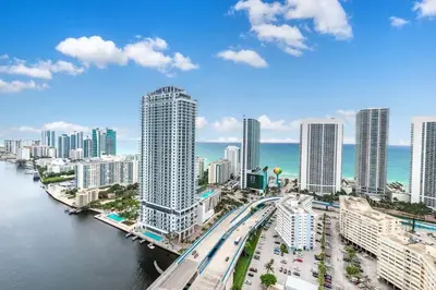 a view of a city with a river and buildings at 2 Bed 2 Bath at Beachwalk with Luxury Pool and Gym in Hallandale Beach