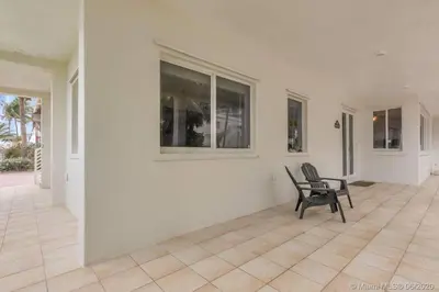 a black chair sitting in the middle of a room at Charming 2-BR space in Hollywood in Hollywood