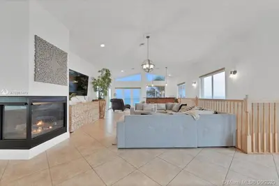 a living room with a couch and a fireplace at Charming 2-BR space in Hollywood in Hollywood