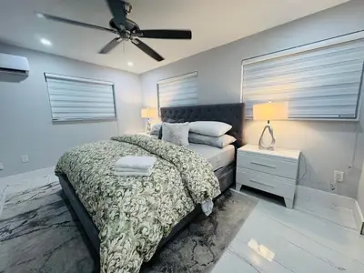 a bedroom with a bed and a ceiling fan at 5 Bedroom Home Location & Charm in Miami