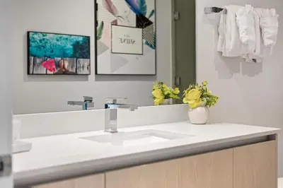 a bathroom with a white sink and a mirror at 42nd Floor Penthouse 3 BDR in Hyde Beach House in Hollywood