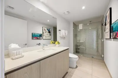 a white bathroom with a sink and a toilet at 42nd Floor Penthouse 3 BDR in Hyde Beach House in Hollywood