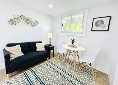 a living room with a couch and a table at Chic Comfortable Boutique Stay in Miami