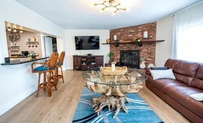 a living room with a couch and a table at The Aqua Villa in Hollywood