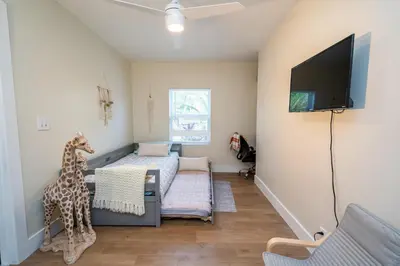 a room with two beds and a giraffe statue in it at The Aqua Villa in Hollywood