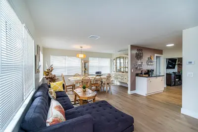 a living room with a blue couch and a table at The Aqua Villa in Hollywood