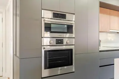 a kitchen with two stainless steel ovens at Miami Oasis by Brickell and Beaches in Miami