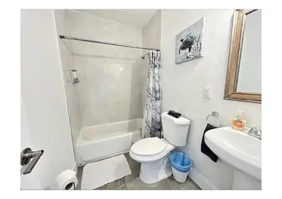 a bathroom with a toilet and a shower and a sink at 2bed Stay in the Heart of Miami in Miami