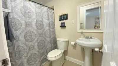 a bathroom with a toilet and a sink and a shower at 1Bed Abode Near Main Attractions in Miami