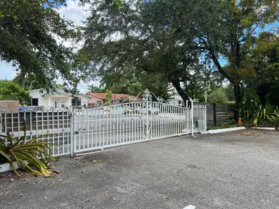 a white fence in front of a playground at Known for its beaches & walk to downtown Hollywood Bliss 3 in Hollywood