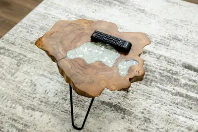 a remote control sitting on top of a wooden table at Your Perfect Oasis in Miami! in Miami