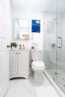a white bathroom with a toilet and a shower at Best Room in Miami ! in Miami