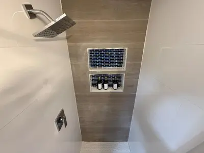a bathroom with a shower and a window with shoes at Stay Near Wynwood in Miami