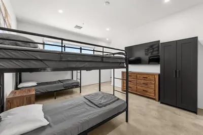 a bedroom with two bunk beds and a desk at Hotel Rainbow - Miami - Little Havanna in Miami